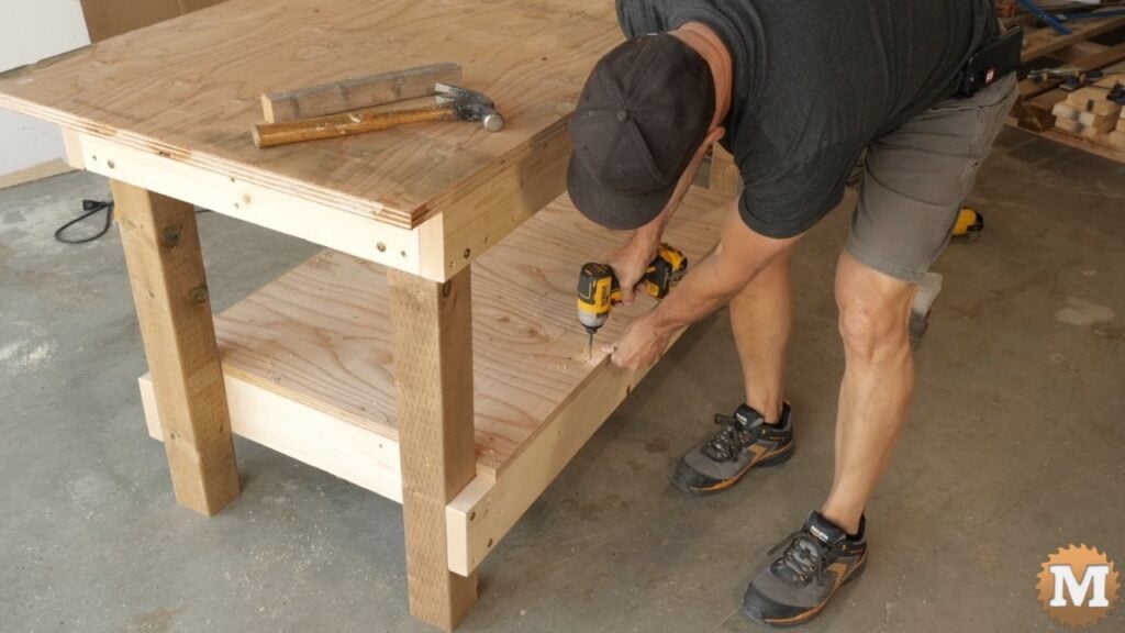 screwing plywood to a workbench frame