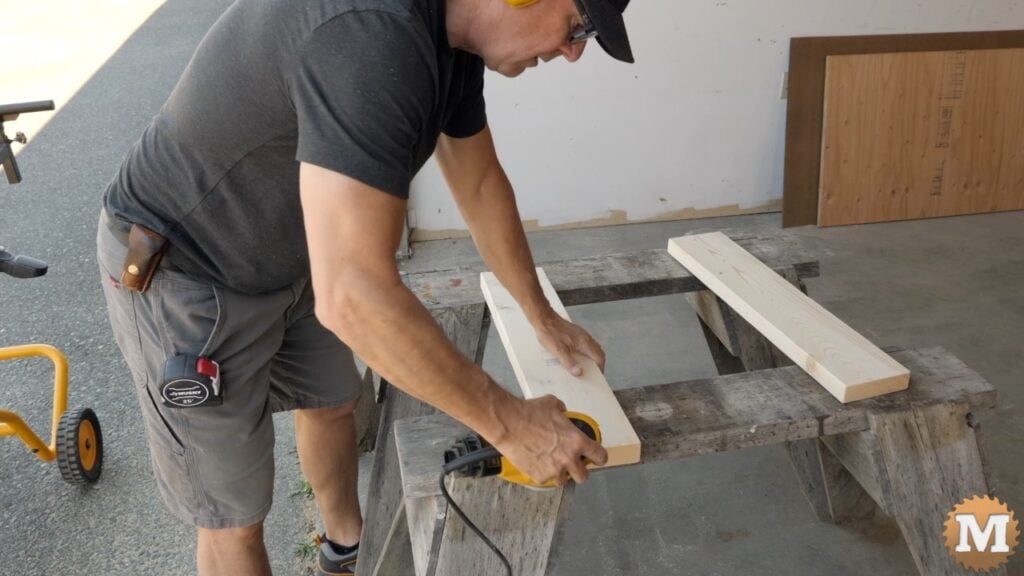 a man sanding wood
