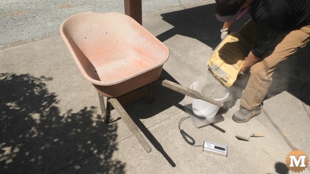 Weighing the dry concrete mix with a scale